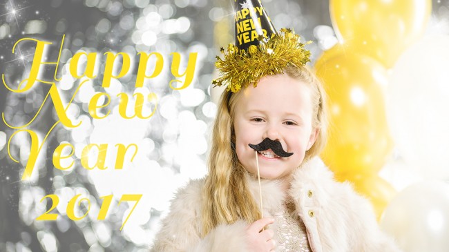 Little beautiful girl at a party New Year with balloons.